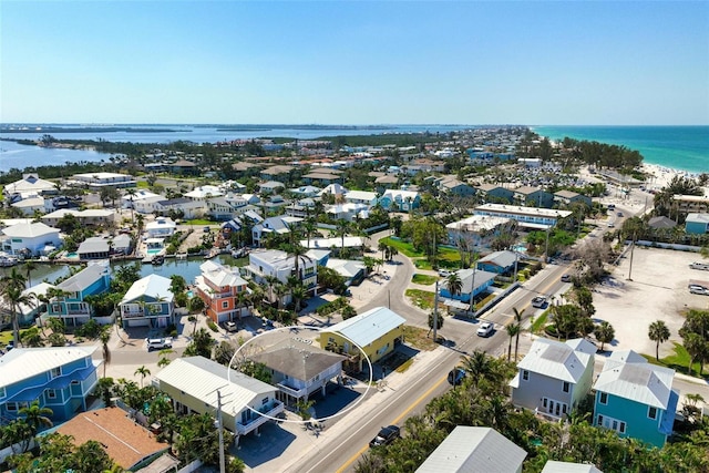 birds eye view of property with a water view and a residential view