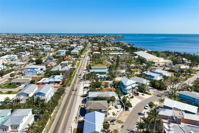 bird's eye view with a water view and a residential view