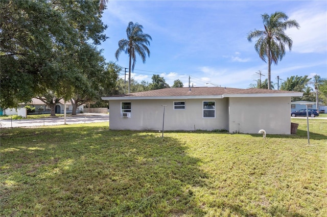 4229 Alna Way, Sarasota, FL 34232 - view of side of property with stucco siding and a lawn
