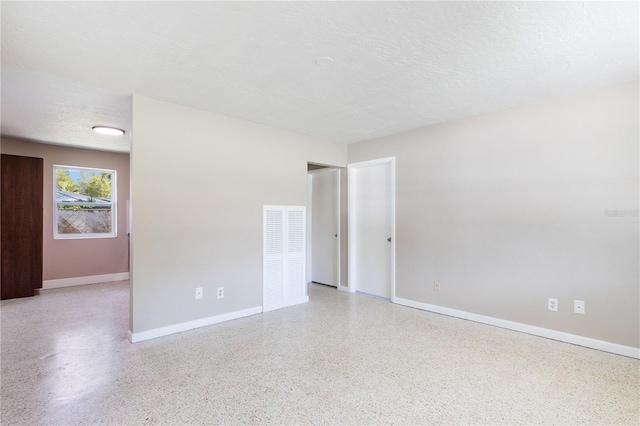 4229 Alna Way, Sarasota, FL 34232 - spare room with speckled floor and baseboards
