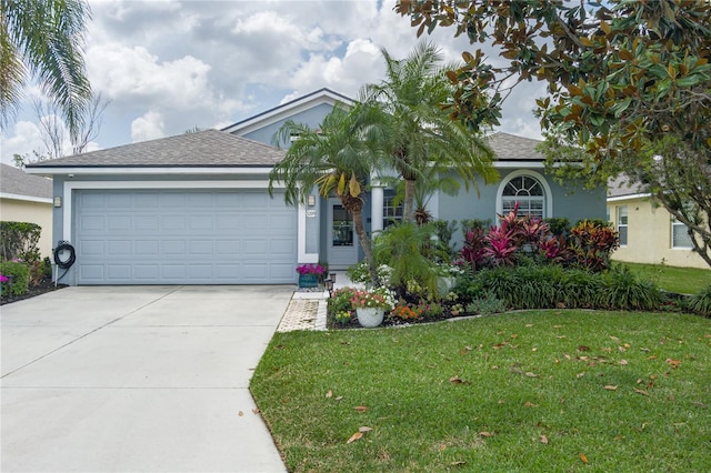 single story home featuring an attached garage, stucco siding, a shingled roof, concrete driveway, and a front yard