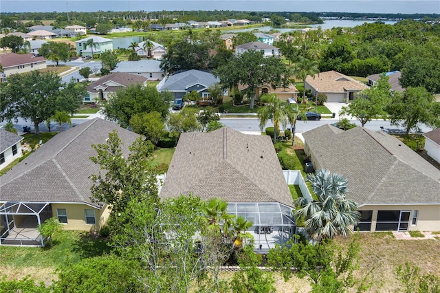 drone / aerial view with a water view and a residential view