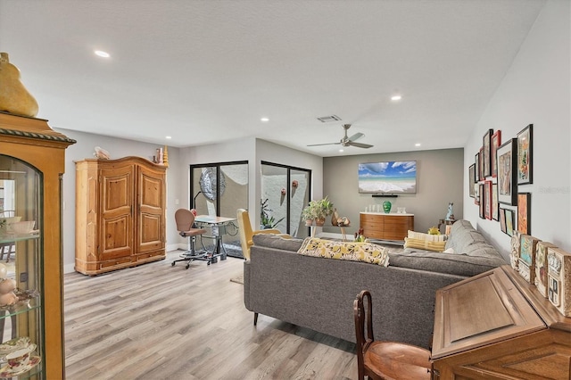 living area featuring recessed lighting, ceiling fan, visible vents, and light wood-style flooring