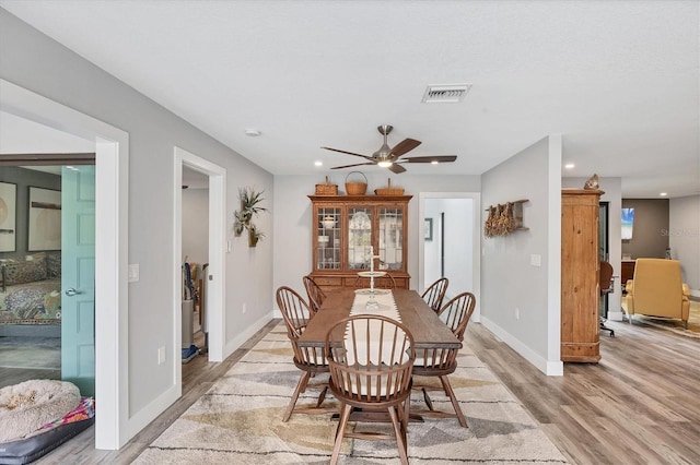 dining room featuring recessed lighting, baseboards, light wood finished floors, and visible vents
