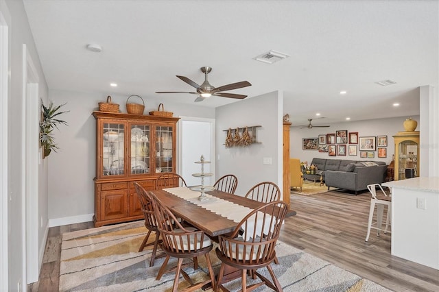 dining room featuring visible vents, a ceiling fan, recessed lighting, and light wood-type flooring