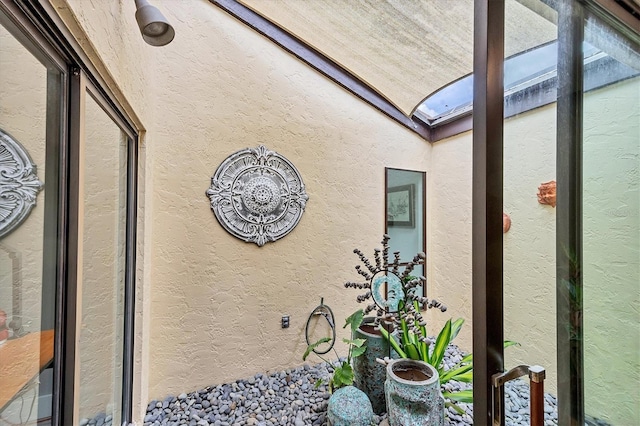 room details featuring a skylight and a textured wall