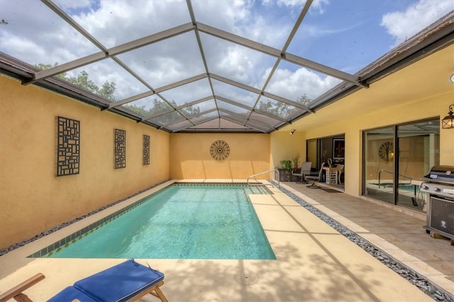 outdoor pool with a patio and a lanai