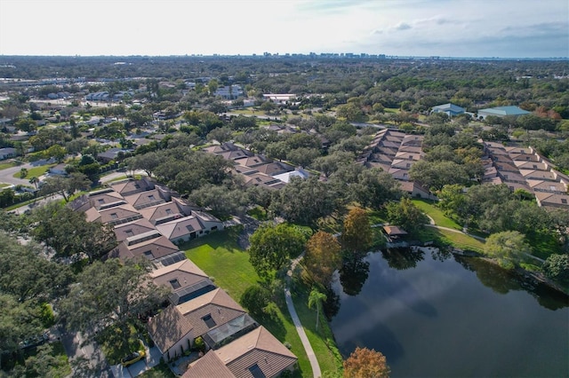 drone / aerial view featuring a water view and a residential view