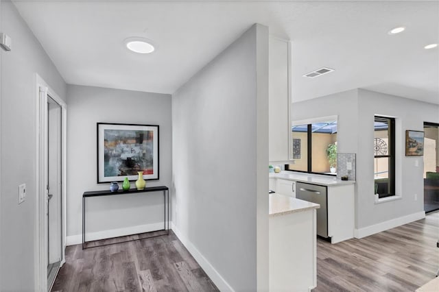3955 Glen Oaks Manor Dr, Sarasota, FL 34232 - hall with wood finished floors and recessed lighting