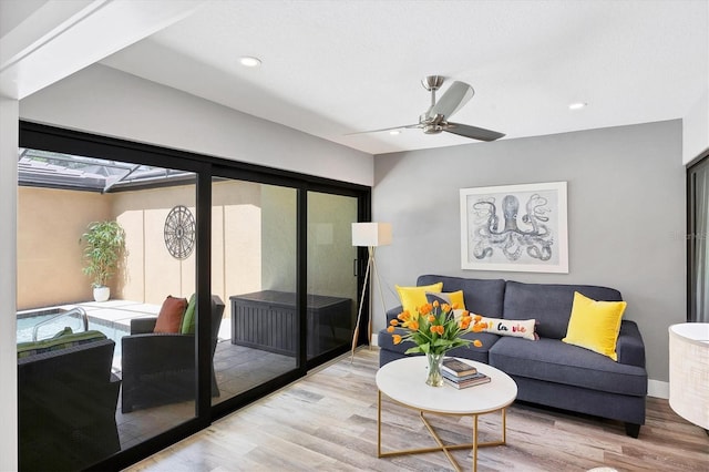 3955 Glen Oaks Manor Dr, Sarasota, FL 34232 - living area featuring wood finished floors, ceiling fan, and recessed lighting