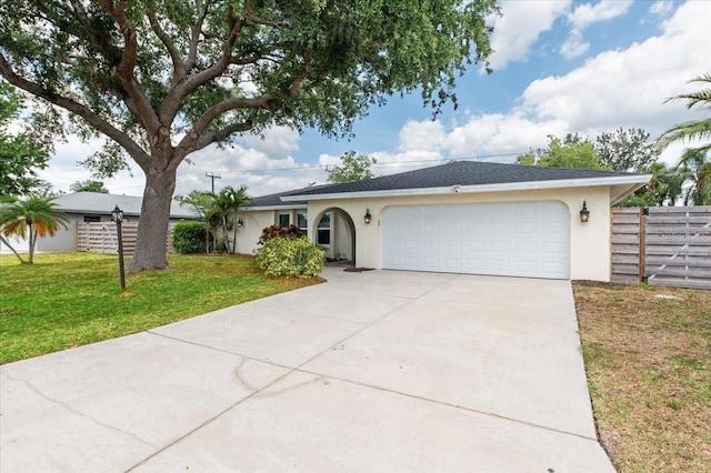 ranch-style home with an attached garage, stucco siding, fence, a front lawn, and driveway