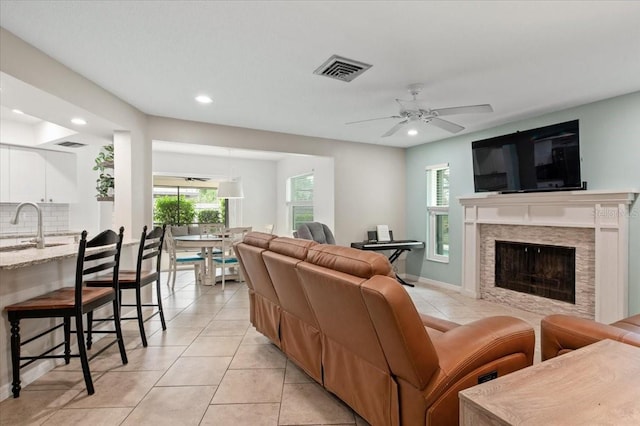 living room featuring recessed lighting, ceiling fan, visible vents, and light tile patterned flooring