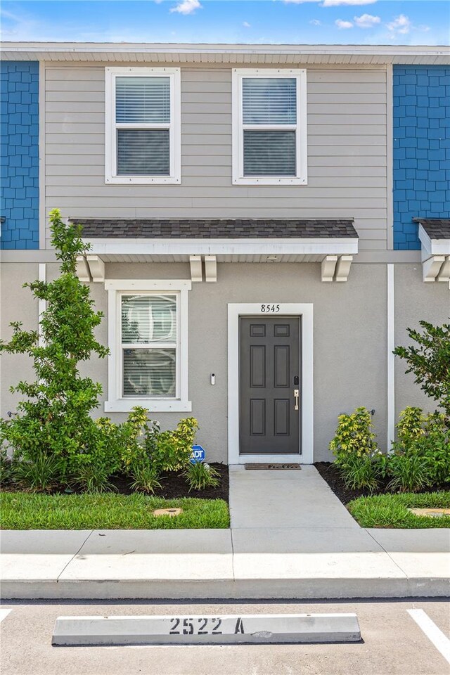 8545 Daybreak St, Sarasota, FL 34241 - view of exterior entry featuring uncovered parking