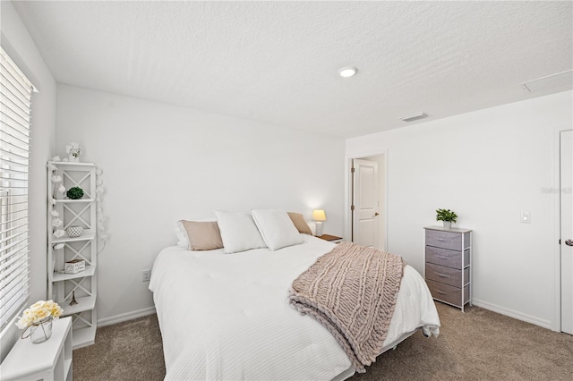8545 Daybreak St, Sarasota, FL 34241 - bedroom with carpet flooring, a textured ceiling, baseboards, and visible vents