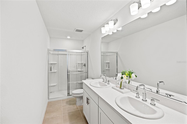 8545 Daybreak St, Sarasota, FL 34241 - bathroom featuring a sink, tile patterned floors, a shower stall, and toilet