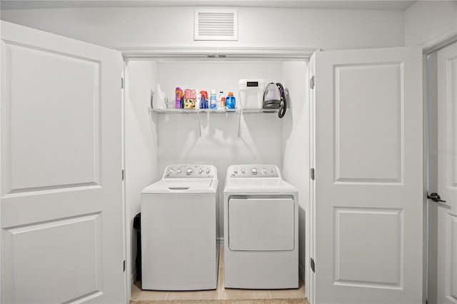 8545 Daybreak St, Sarasota, FL 34241 - laundry room featuring visible vents, laundry area, and washer and clothes dryer