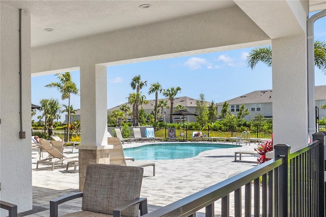 8545 Daybreak St, Sarasota, FL 34241 - community pool featuring fence, a patio area, and a residential view