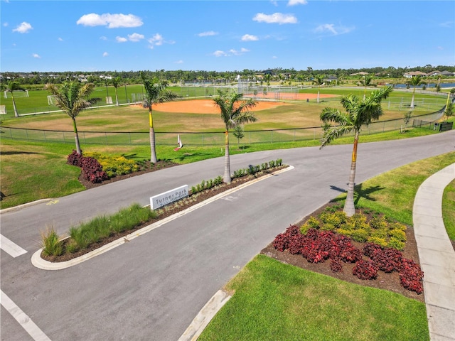 8545 Daybreak St, Sarasota, FL 34241 - view of home's community with fence, a yard, and golf course view