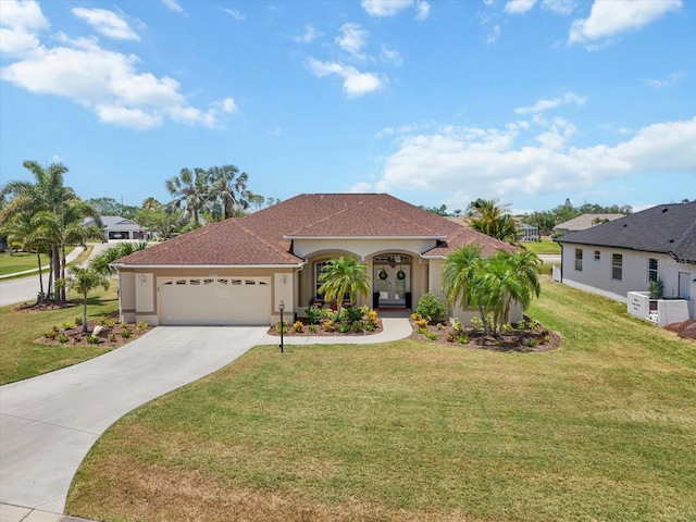 9012 Province St, Sarasota, FL 34240 - view of front of property with a garage, driveway, a front lawn, and stucco siding