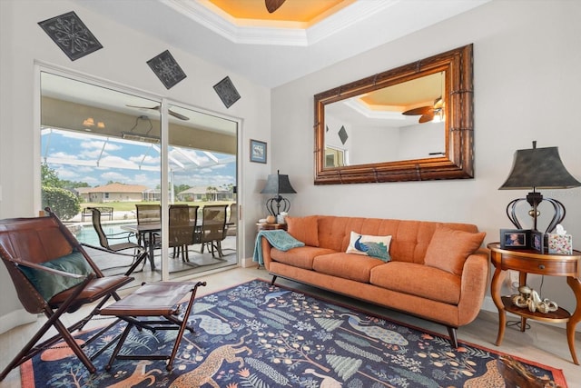 9012 Province St, Sarasota, FL 34240 - living room featuring a tray ceiling, ornamental molding, baseboards, and a ceiling fan