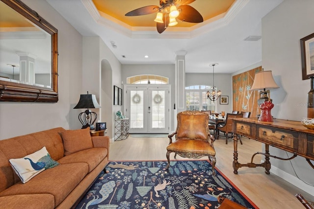 9012 Province St, Sarasota, FL 34240 - living area with wood finished floors, french doors, a ceiling fan, a chandelier, and ornamental molding