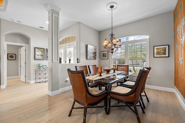 9012 Province St, Sarasota, FL 34240 - dining space featuring light wood-style floors, baseboards, and a chandelier