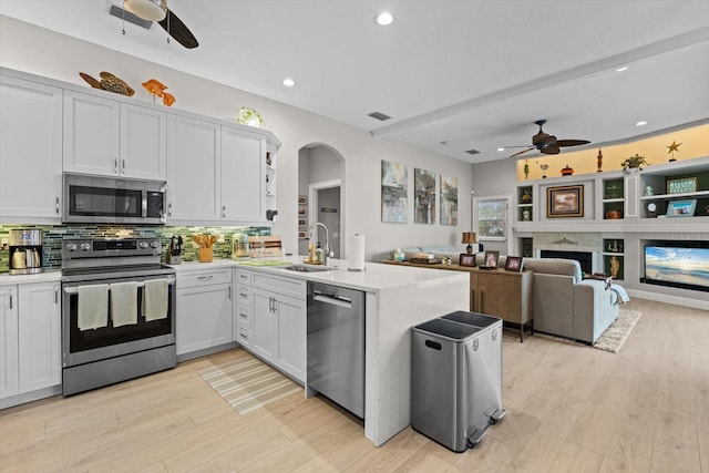 9012 Province St, Sarasota, FL 34240 - kitchen with appliances with stainless steel finishes, ceiling fan, a sink, a peninsula, and recessed lighting