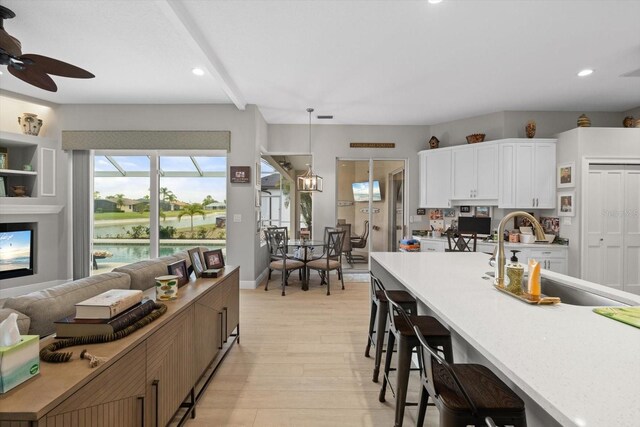 9012 Province St, Sarasota, FL 34240 - kitchen featuring a sink, a ceiling fan, light wood-style flooring, light countertops, and recessed lighting