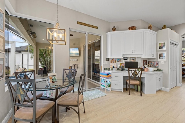 9012 Province St, Sarasota, FL 34240 - dining space featuring a chandelier, plenty of natural light, and light wood finished floors