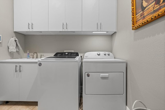 9012 Province St, Sarasota, FL 34240 - laundry room featuring separate washer and dryer and cabinet space