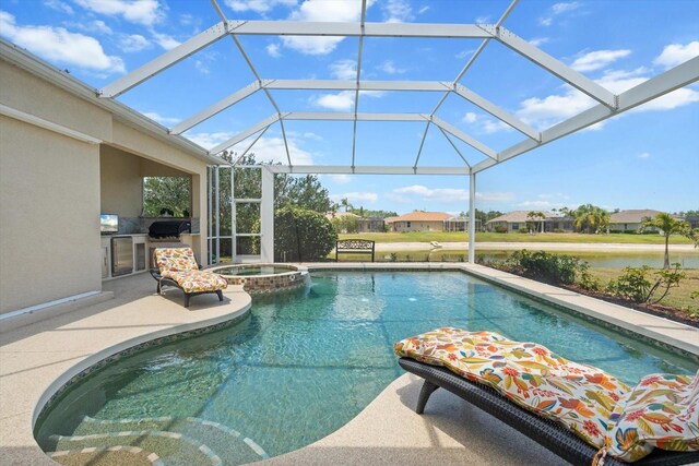 9012 Province St, Sarasota, FL 34240 - view of pool featuring exterior kitchen, a patio, a pool with connected hot tub, and a lanai