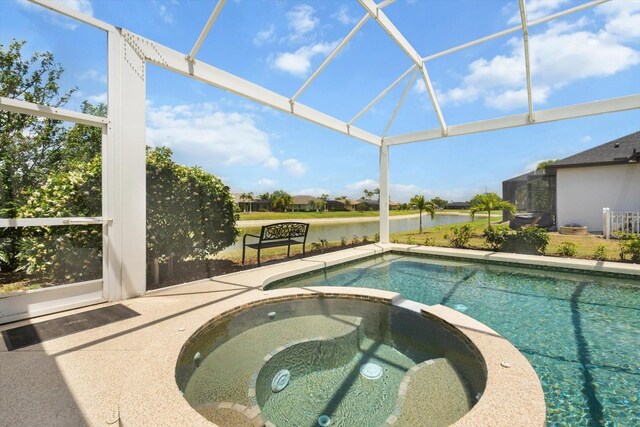 9012 Province St, Sarasota, FL 34240 - view of swimming pool with a water view, a pool with connected hot tub, glass enclosure, and a patio