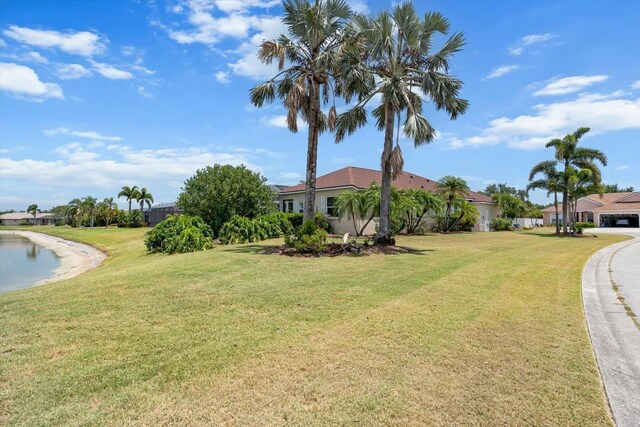 9012 Province St, Sarasota, FL 34240 - view of side of property with a yard