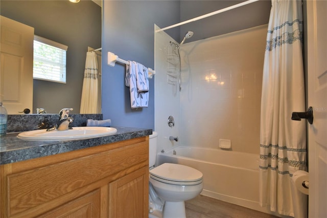 full bathroom with toilet, wood finished floors, shower / bath combo, and vanity