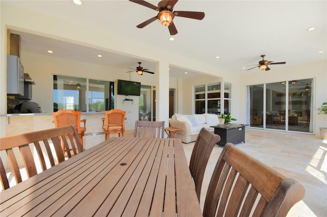 exterior space with a ceiling fan and recessed lighting