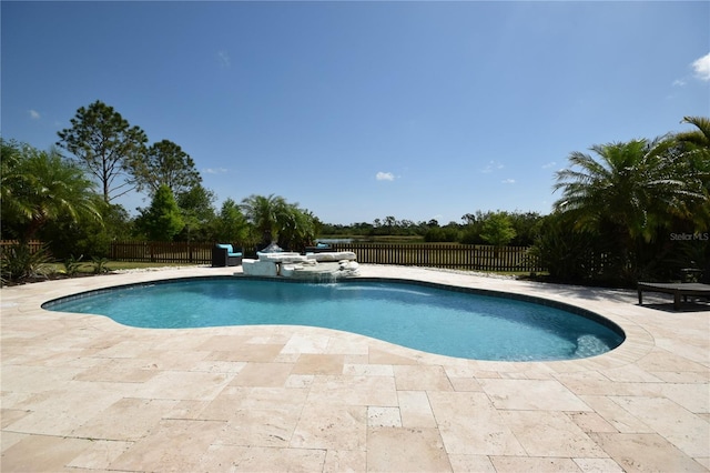 view of pool featuring a fenced in pool, a fenced backyard, and a patio