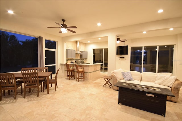 living area featuring recessed lighting and a ceiling fan