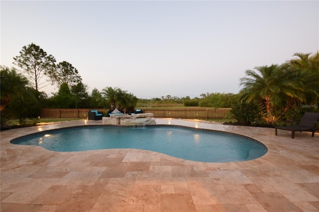 view of pool featuring a fenced in pool, a fenced backyard, and a patio area