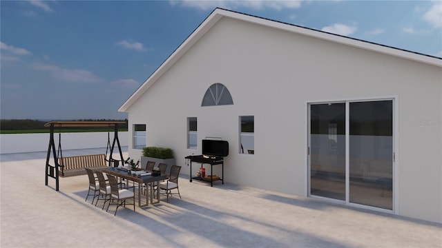 12535 Estrella Blvd, Punta Gorda, FL 33955 - rear view of house with outdoor dining area, a patio, and stucco siding