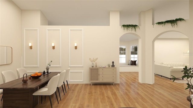 12535 Estrella Blvd, Punta Gorda, FL 33955 - dining space with light wood-style floors and arched walkways