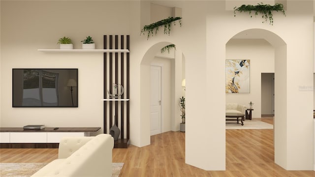 12541 Estrella Blvd, Punta Gorda, FL 33955 - corridor featuring arched walkways and light wood-style flooring