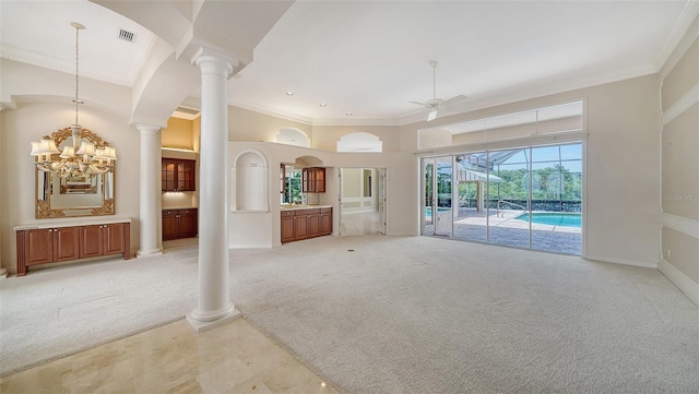 unfurnished living room with crown molding, ceiling fan with notable chandelier, visible vents, and light carpet
