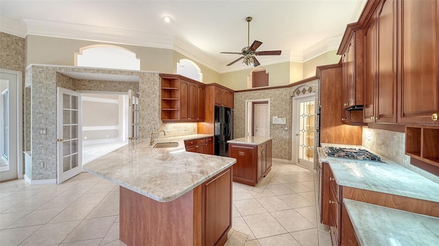 kitchen with open shelves, a ceiling fan, freestanding refrigerator, a sink, and light tile patterned floors