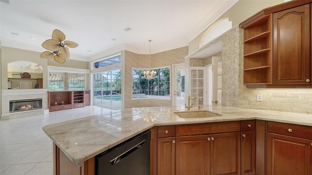 kitchen featuring open shelves, a ceiling fan, ornamental molding, a sink, and dishwasher