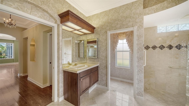 full bathroom with a healthy amount of sunlight, baseboards, crown molding, and wallpapered walls