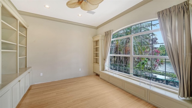 empty room featuring crown molding, recessed lighting, ceiling fan, and light wood finished floors