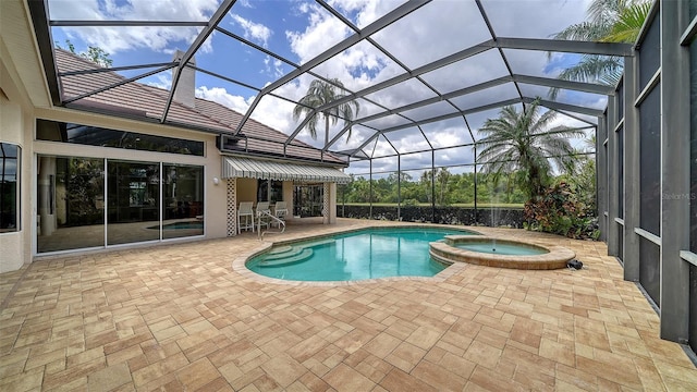 view of pool featuring a lanai, a patio, and a pool with connected hot tub