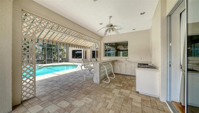 pool featuring a patio and a ceiling fan