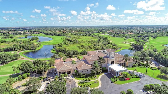 aerial view with a water view, view of golf course, and a residential view