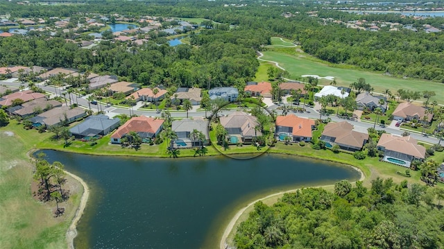bird's eye view featuring a water view, view of golf course, and a residential view